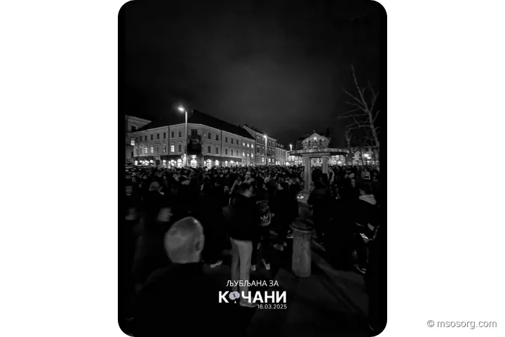 Attendees standing together during the moment of silence